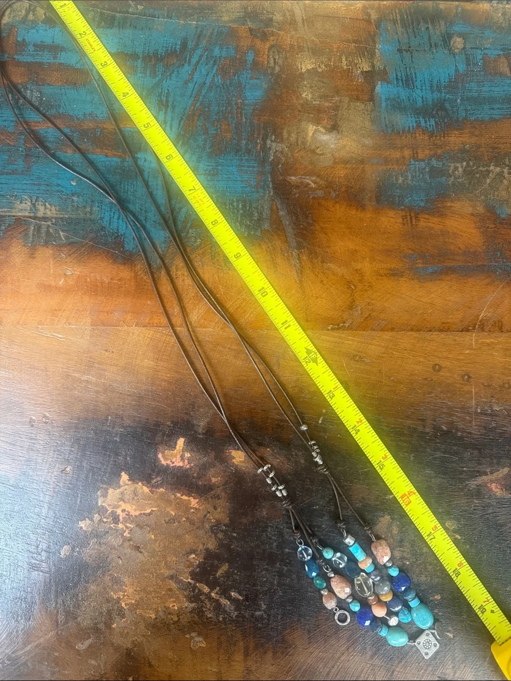 5 tassel lariat leather cord necklace. New with tags from Sundance.
